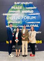 A group of people standing in front of a sign
AI-generated content may be incorrect.