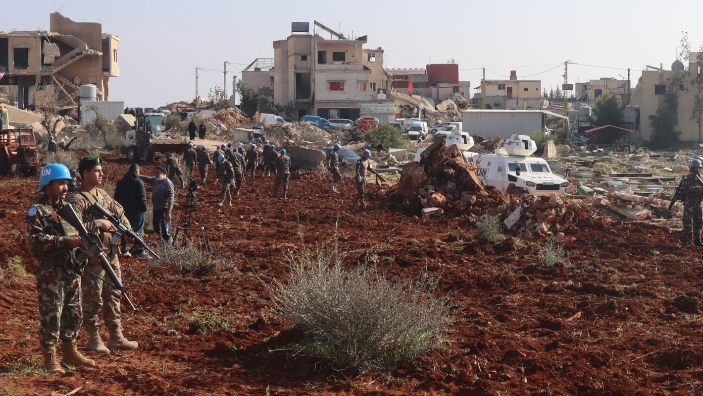 Peacekeepers assist Blida residents to prepare field for olive plantation