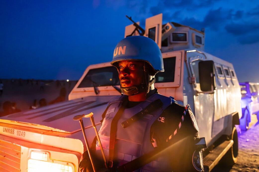 Police Officer in front of a patrol car