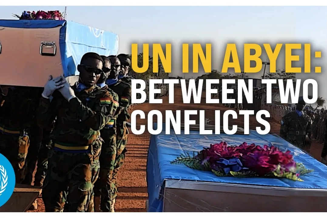 Peacekeepers carrying a coffin.